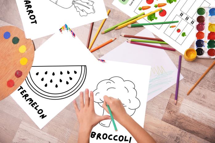 Children's coloring activity with vegetables and art supplies on a wooden table.