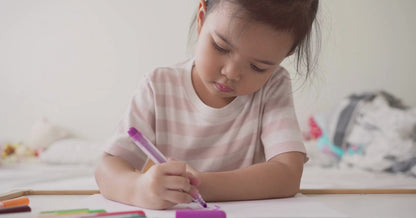 A little girl is coloring a princess