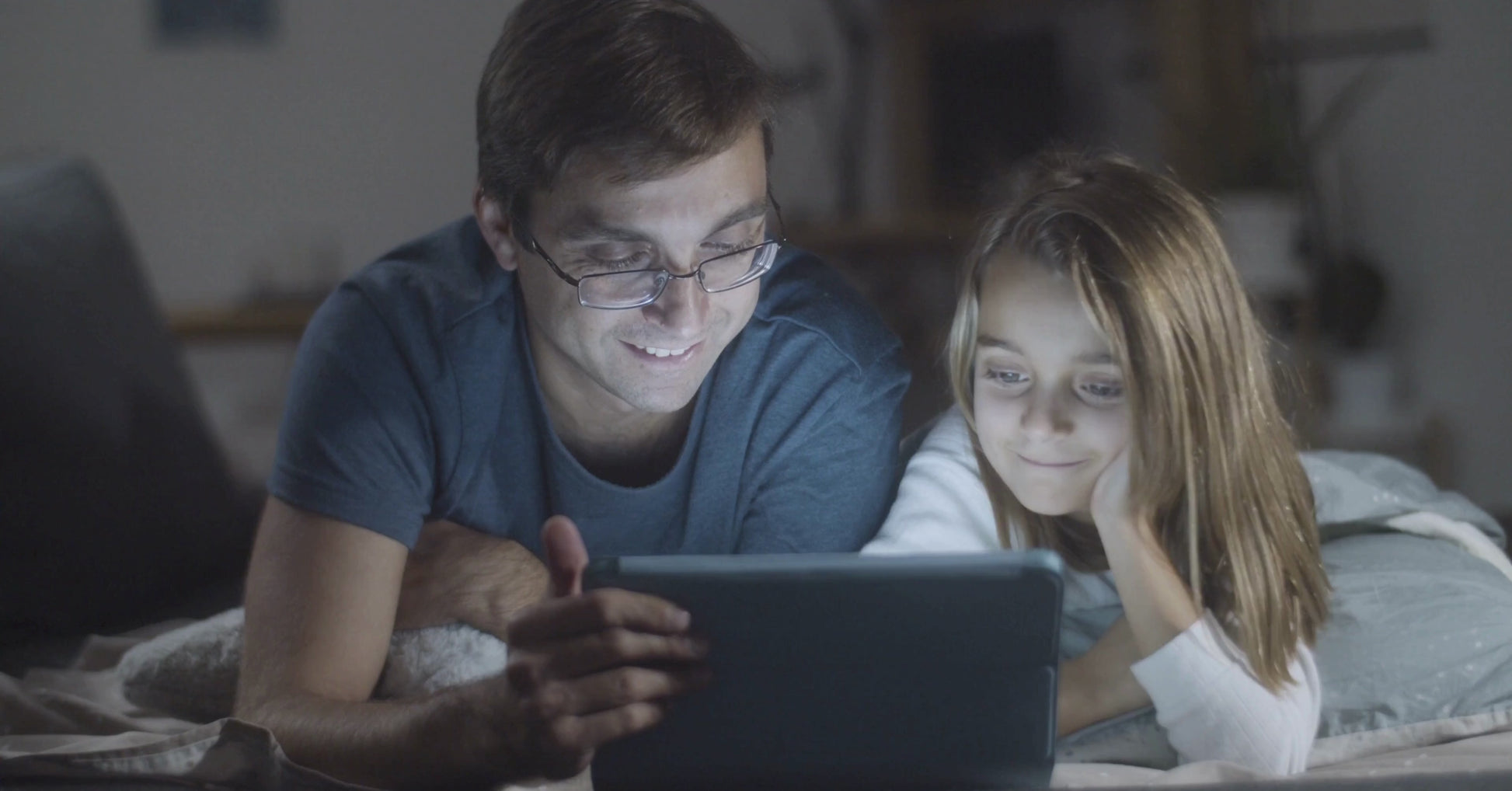 A father and his daughter are reading the story Lina and Toto's Adventure by KidzzyLab.